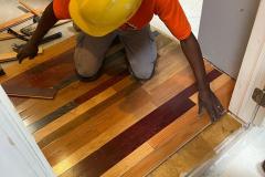 installing-hardwood-floor-by-student
