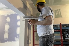 yca-student-adding-compound-to-drywall