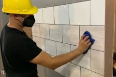 yca-student-cleaning-tiles