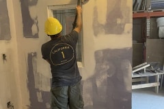 yca-student-sanding-drywall