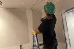 yca-student-taping-ceiling