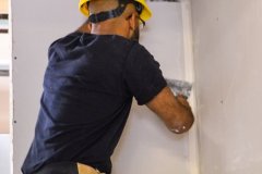 yca-student-fixing-drywall